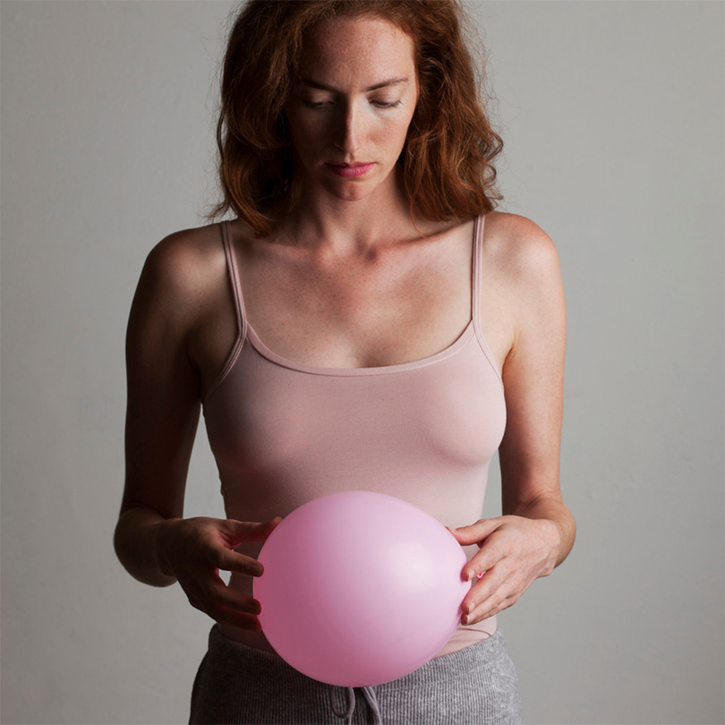 woman with balloon over belly