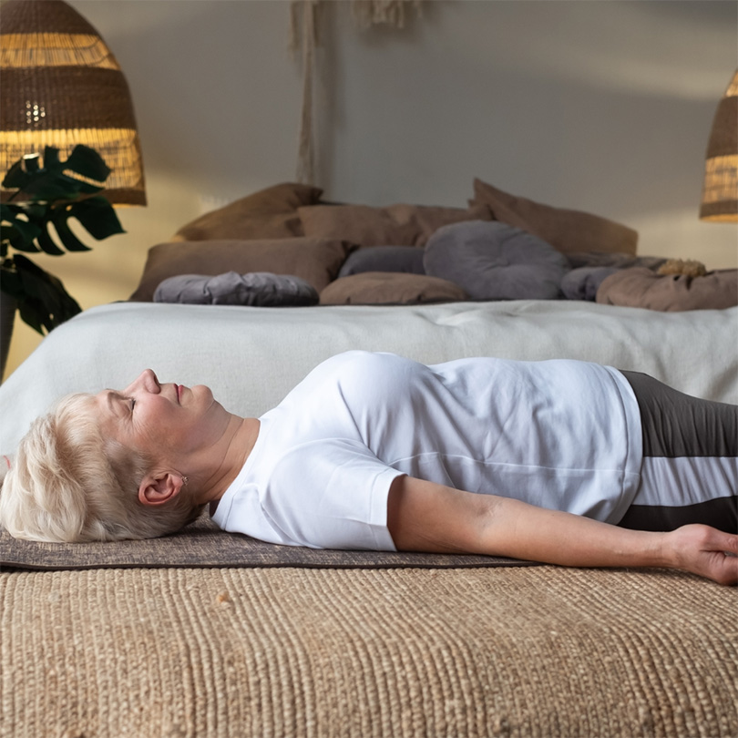 woman lying down on floor relaxing