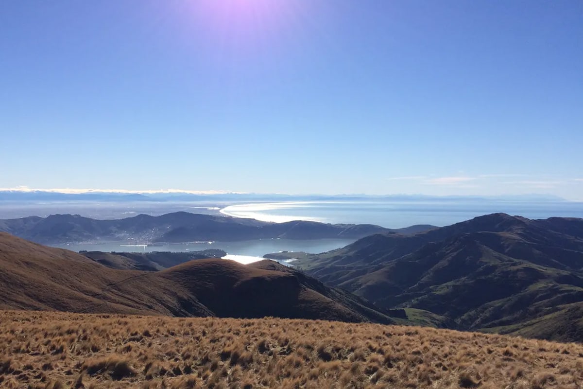 sunny day over hills and ocean